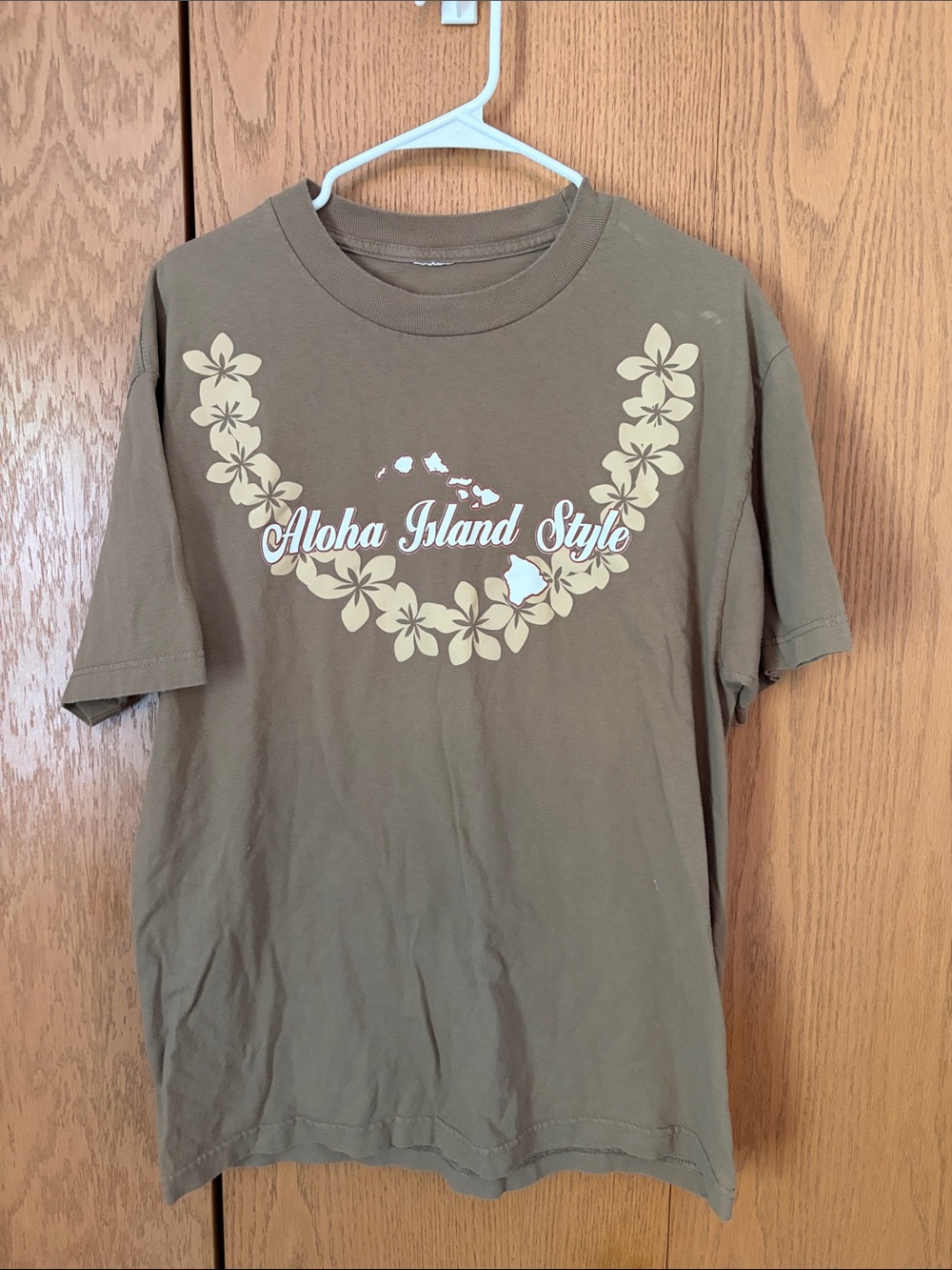 Aloha Island Brown Short Sleeve Tee with Cream Floral Lei Graphic